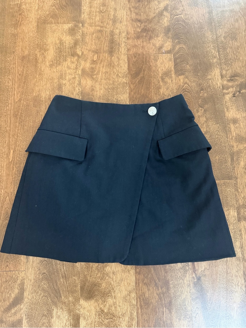 Maje Black Asymmetric Wrap-Front Mini Skirt with Button Detail and Flap Pockets
